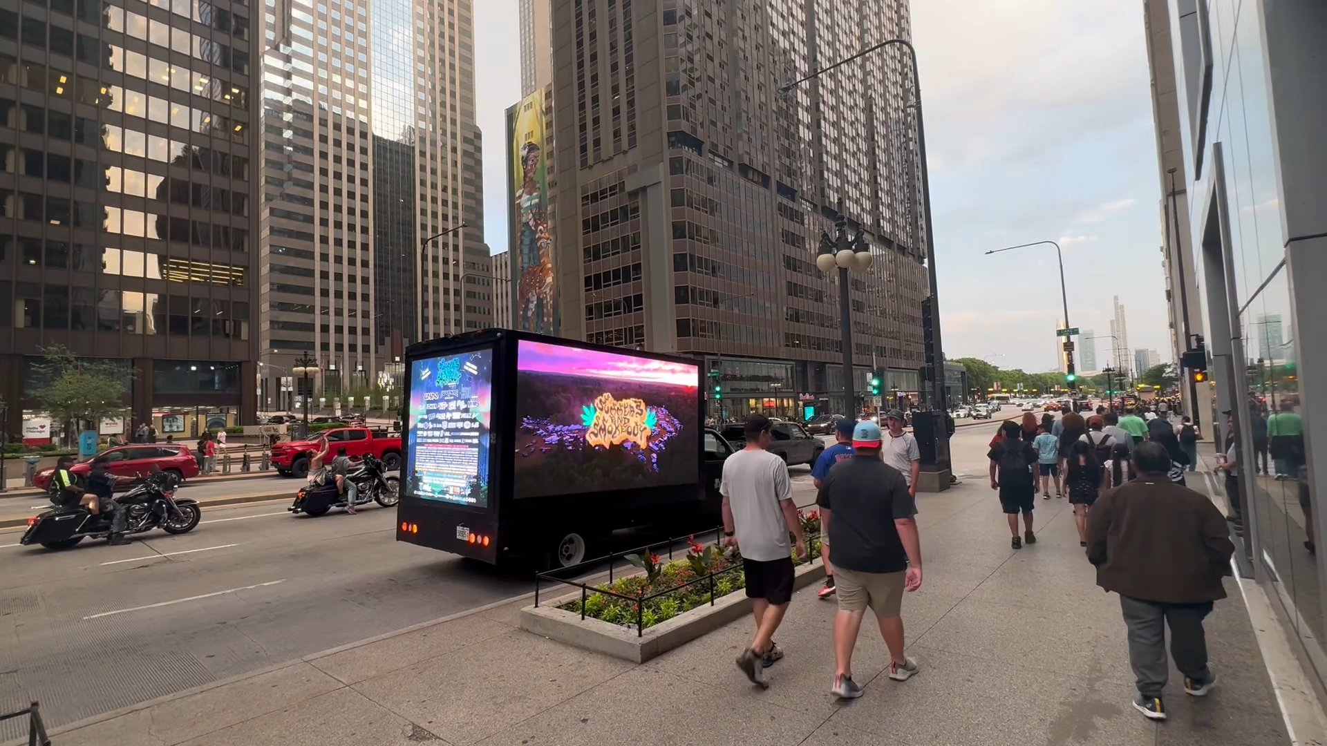 AOTC LED truck on Chicago street with pedestrians