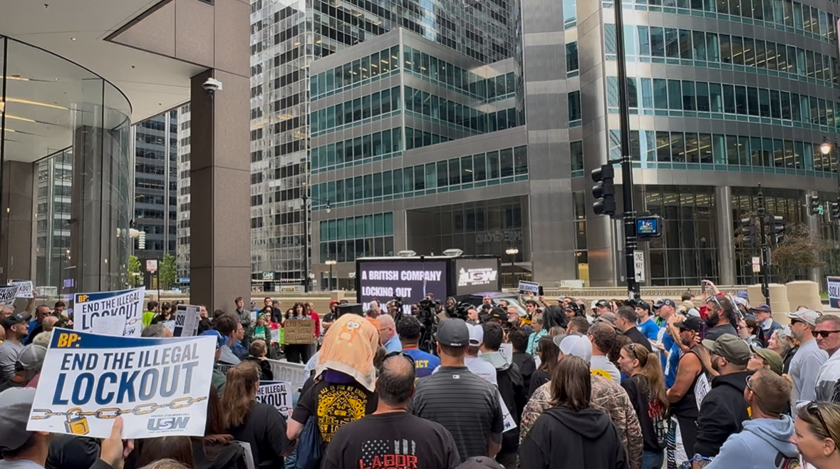 Crowd of USW supporters gathered around the AOTC LED truck outside BP's downtown Chicago offices